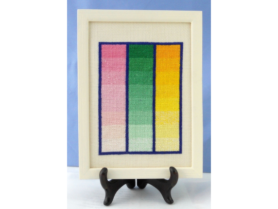 table view of framed Amish quilt block